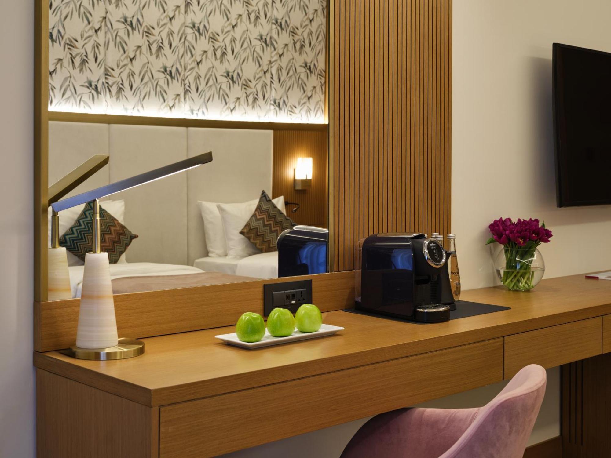 Qafqaz Riverside Hotel Gabala Exterior foto A Nespresso machine in a hotel room