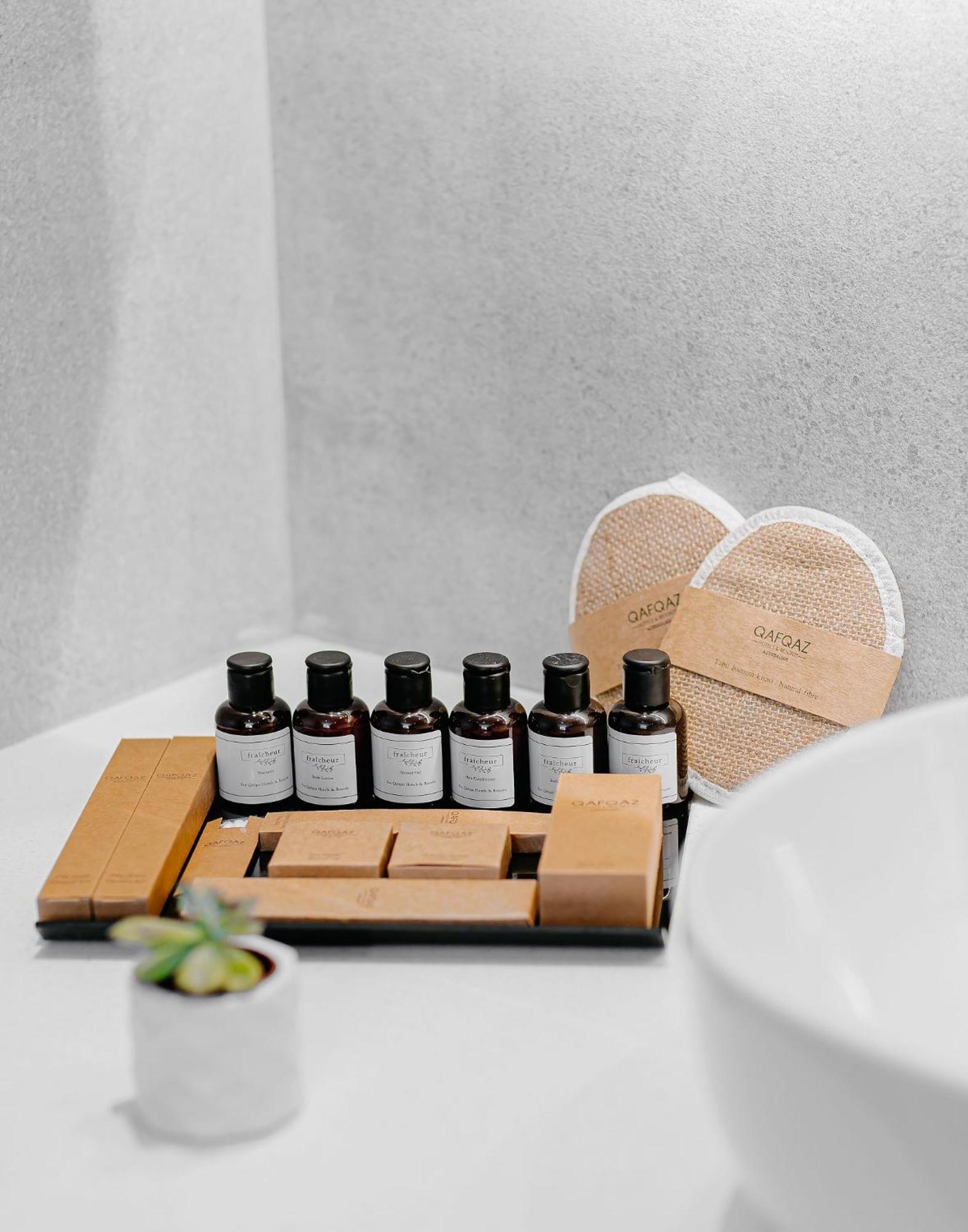 Qafqaz Riverside Hotel Gabala Exterior foto A selection of amenities by the brand
